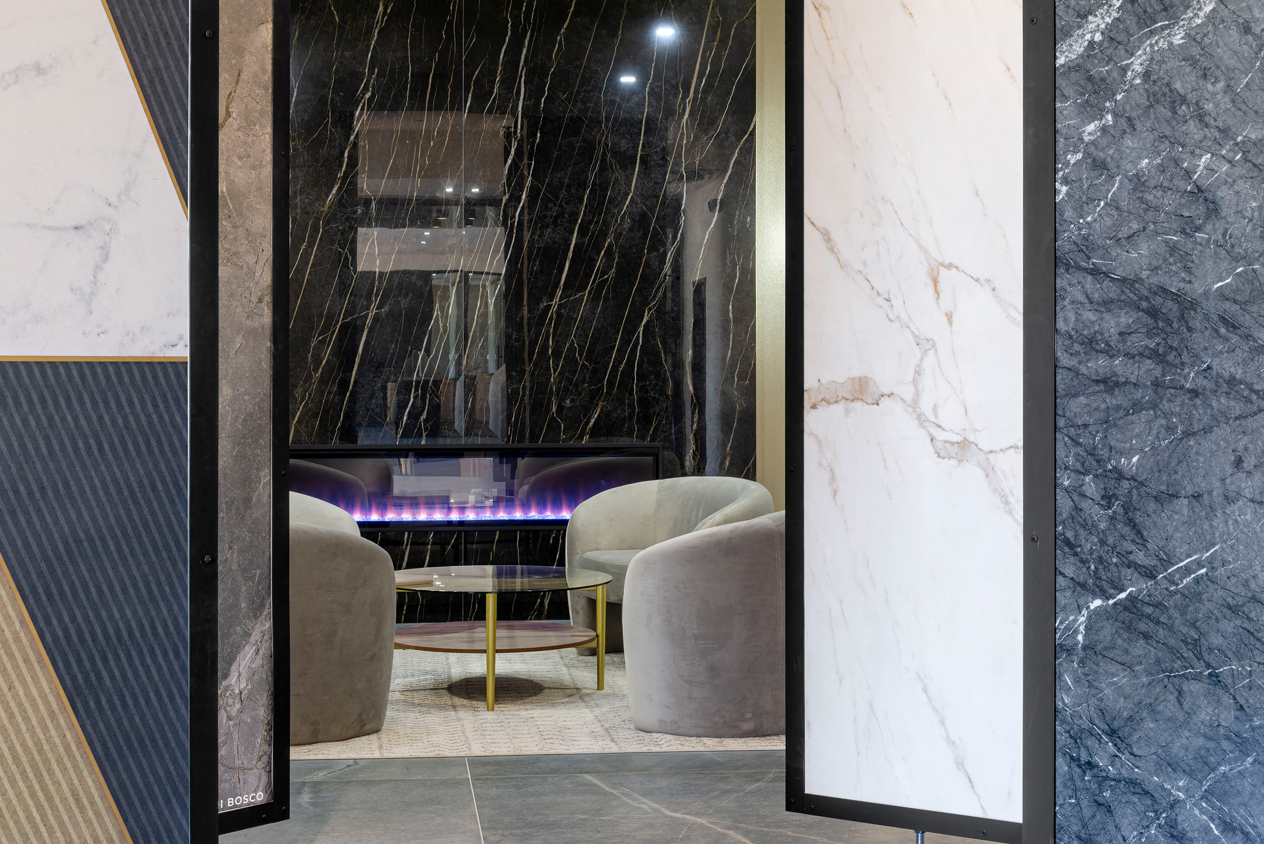 Large-format porcelain fireplace and sintered stone displayed in Moderno Porcelain Works showroom