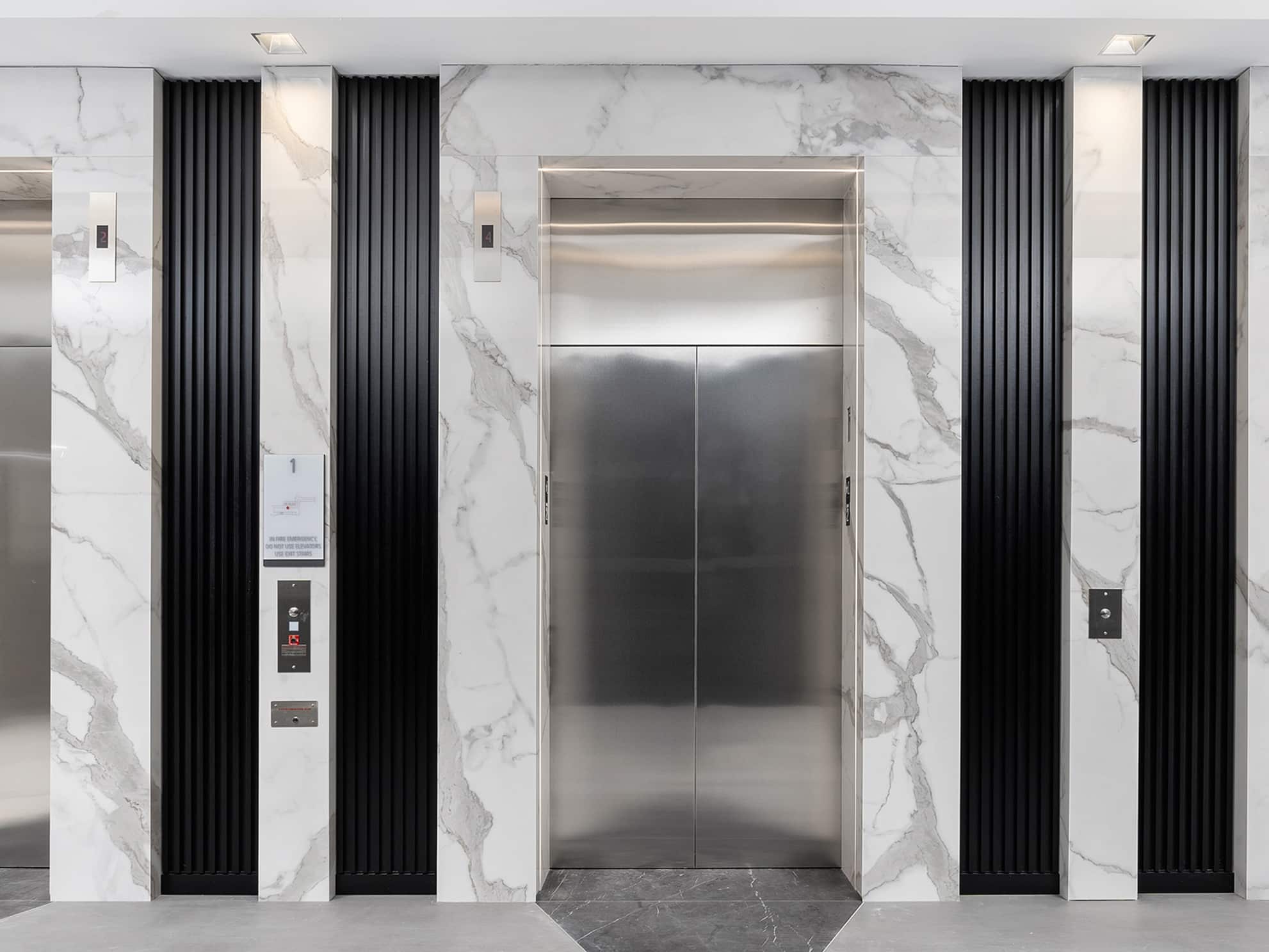 Porcelain Flooring and Elevators in White Classico & Pietra Gray | AFTER