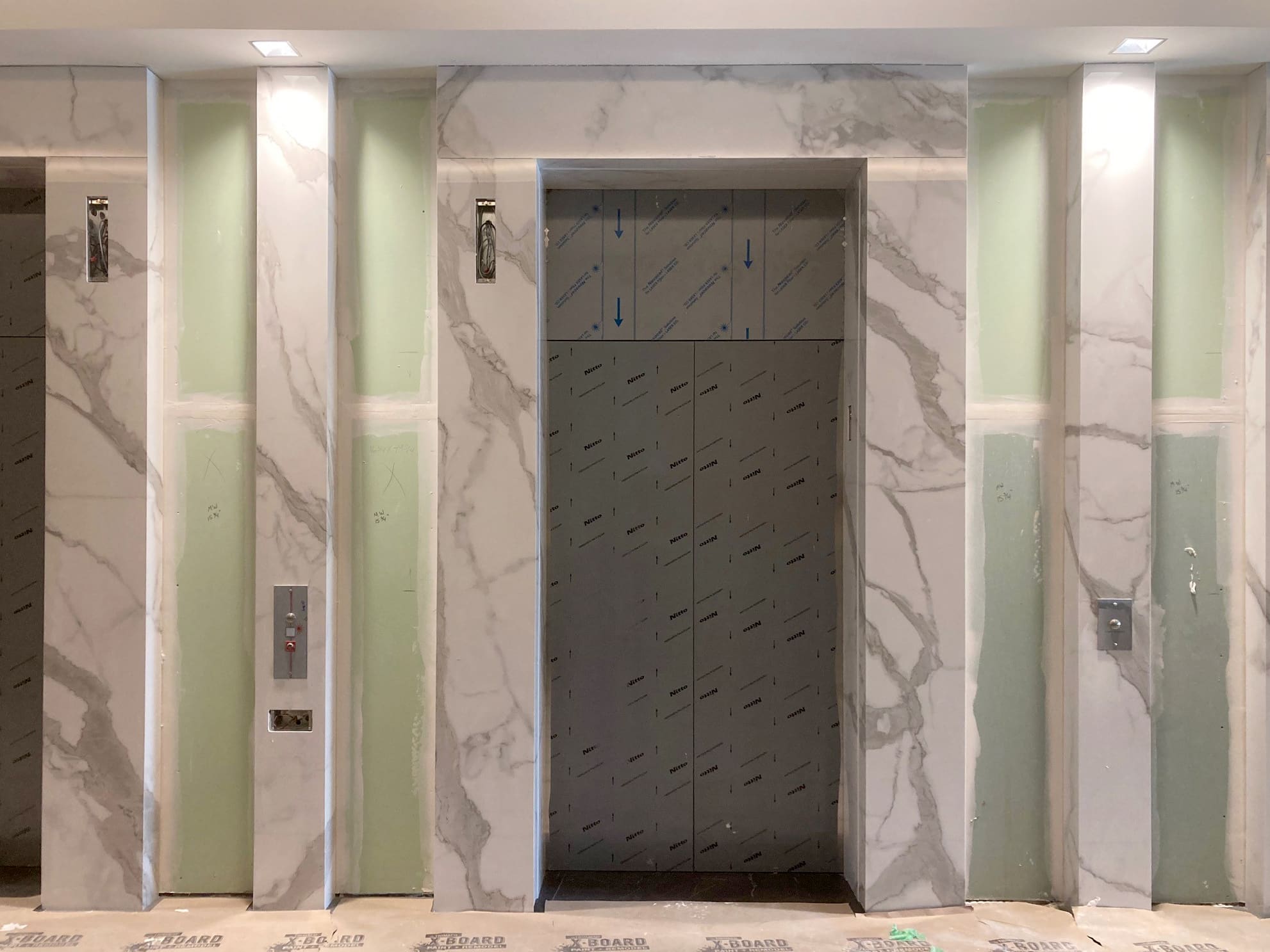 Porcelain Flooring and Elevators in White Classico & Pietra Gray | BEFORE