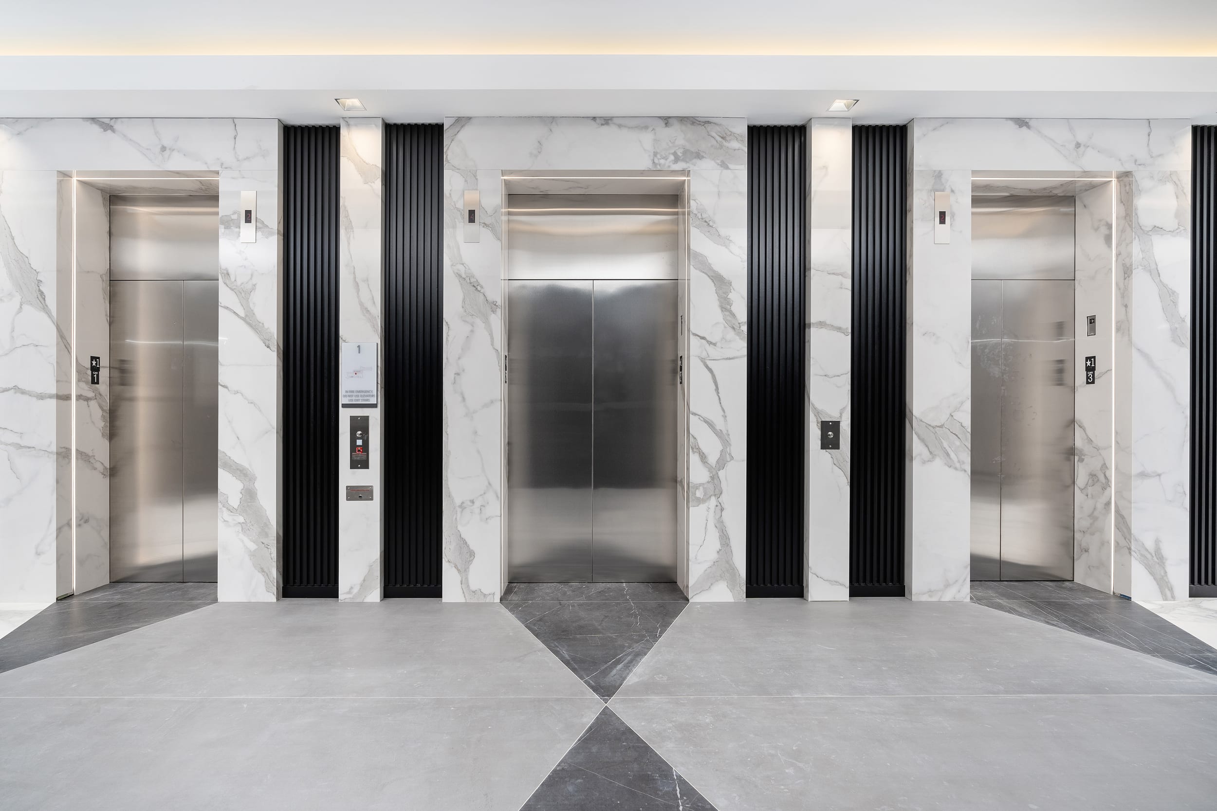 Porcelain Flooring and Elevators in White Classico & Pietra Gray