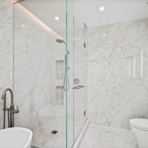 Large-format Porcelain Sintered Stone Shower Wall Cladding, Shower Niches, and Flooring in Bianco Carrara